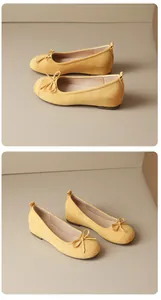 Elegant yellow suede ballet flats with bow detail and French round toe design