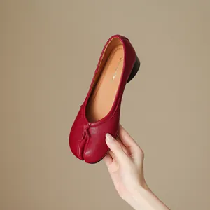 Elegant red leather tabi split-toe low heel ballet flats with pleated detail.