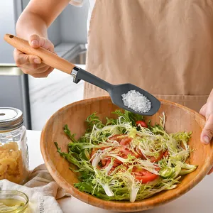 Professional silicone cooking spatula with solid wood handle for salad seasoning