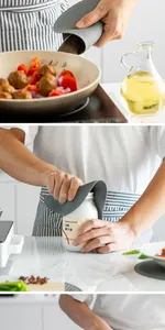 Grey honeycomb silicone mat used as a pan handle grip and jar opener in a kitchen