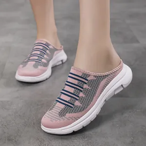 Lightweight pink mesh slip-on mules for summer casual wear with breathable fabric.