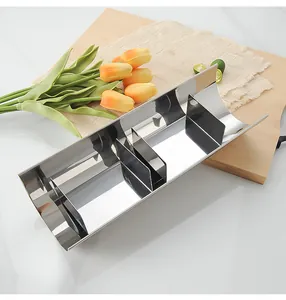 Detail view of adjustable semi-circular stainless steel mousse and toast baking mold