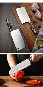 Professional stainless steel kitchen knife set with decorative hollow handle slicing a tomato