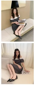 Close-up lifestyle view of black patent leather pointed-toe flats worn with an elegant dress