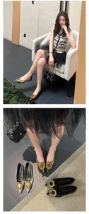 Detail of pointed-toe flat shoes with gold metal buckles in gold, silver, and black.