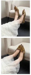 Elegant pointed-toe gold flats with metal buckle and soft sole for women