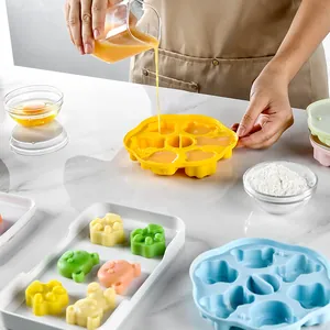 Bear-shaped silicone baby food mold for steaming cakes and pudding in a bright kitchen setting