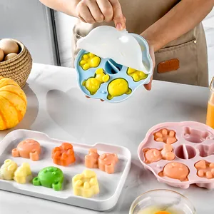 Cute bear silicone mold for baby food and steamed cakes in a kitchen setting.