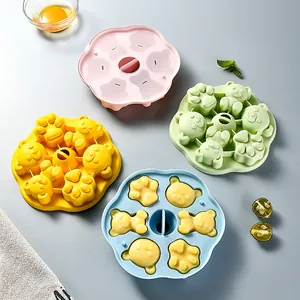 Bear and paw shaped silicone baby food molds in pastel colors for steaming and freezing
