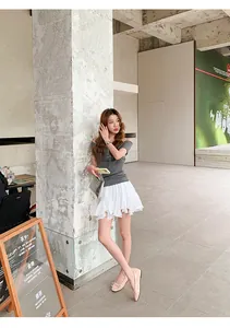 Asian model posing in French style beige bow ballet flats with a soft sole for daily wear