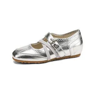 Silver metallic Mary Jane ballet flats featuring cross straps and sporty rubber sole