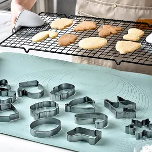 Full set of Christmas cookie cutters with gingerbread man and tree shapes for holiday baking