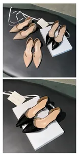 Macro view of elegant black patent leather pointed toe d'Orsay flats with side cutout