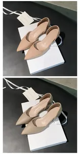 Detailed view of French nude pointed-toe d'Orsay flats with elegant patent finish