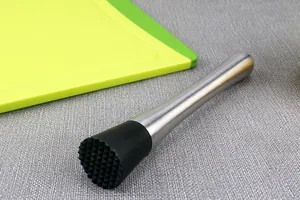 Close-up detail of a professional 304 stainless steel cocktail muddler with black head