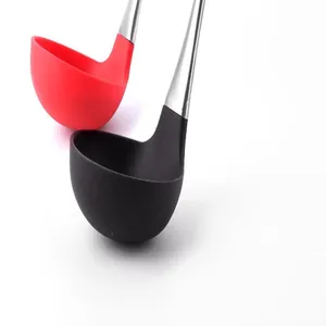 Close-up of red and black heat-resistant silicone soup ladles with stainless steel handles.
