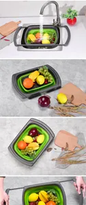 Collapsible square kitchen colander with retractable handles shown with fresh fruit