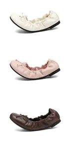 Detail of French bow ballerina flats in white, pink, and brown with soft rubber soles