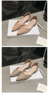 Detail view of French style nude pointed-toe D'Orsay flats with inner heightening effect.