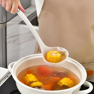 Cream silicone oil filter soup ladle shown over a pot with corn and vegetable soup