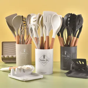 12-piece silicone kitchen utensil set with wooden handles and storage canister