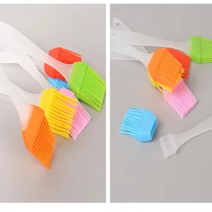 Detail of detachable silicone basting brush with translucent handle for BBQ and baking.