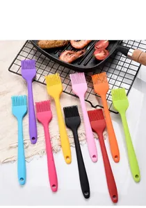 Assorted colors of small silicone basting brushes for BBQ and professional kitchen use