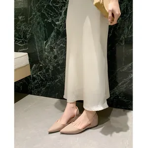 Elegant French nude pointed-toe patent leather flats with subtle internal heightening