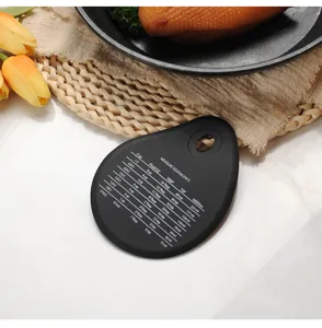 Detailed macro view of black teardrop silicone dough scraper with printed measurement equivalents