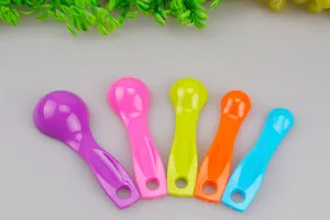Detailed close-up shot showing a 5-piece colorful plastic measuring spoon set for baking