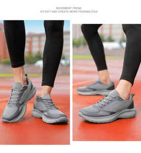 Detailed view of grey breathable mesh running shoes for men shown on an outdoor track