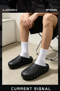 Men's chunky black clogs with breathable perforated design and thick soles