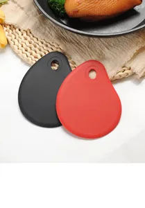 Durable red and black teardrop silicone scrapers for dough and butter in kitchen scene