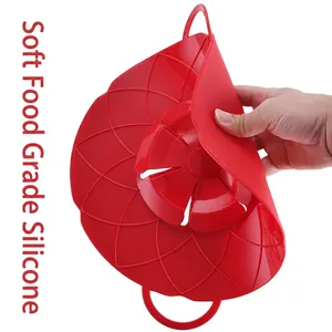Flexible red food-grade silicone spill-proof pot lid with petal design and handles
