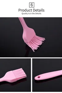 Detail view showing head and handle of a pink heat-resistant silicone basting brush for BBQ