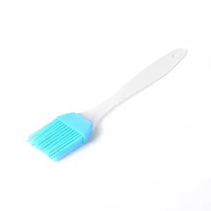 Small blue silicone basting brush with translucent handle for baking and BBQ cooking