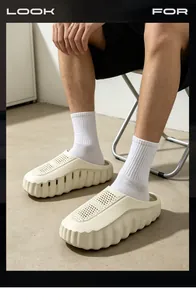 Detailed view of cream-colored thick-soled breathable clogs worn with white socks