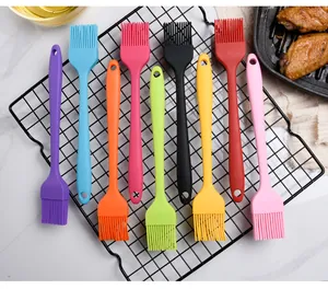 Set of 9 colorful silicone BBQ brushes on a wire rack for basting and grilling.