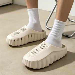 Comfortable thick-soled beige clogs for summer beach wear with perforated upper