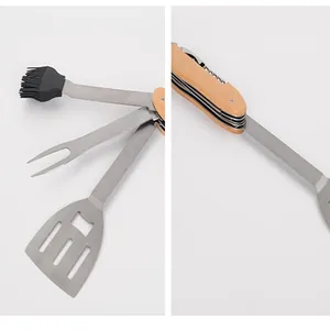 Detail view of foldable stainless steel BBQ tool set with wooden handle and brush
