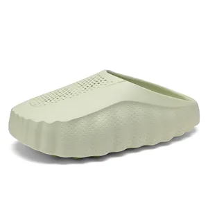Stylish light green thick-soled clogs with perforated breathable upper for summer beach wear