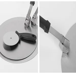 Detailed view of professional stainless steel folding pizza peel and round cutter set
