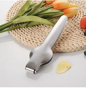 Close-up detail of a multifunctional stainless steel chestnut opener with scraper