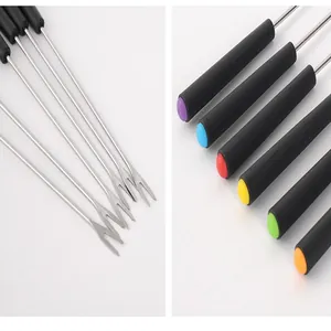 Detailed close-up of stainless steel fondue forks with color-coded plastic handles