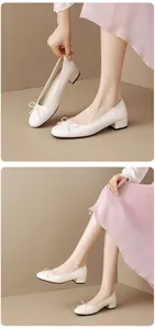 Close-up of elegant cream round toe ballet flats featuring bow detail and low chunky heel