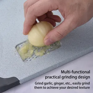 Non-slip wheat straw cutting board with integrated grater for garlic and ginger