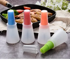 Detailed view of heat-resistant silicone oil brush bottles in four vibrant colors