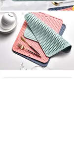 A stack of colorful wavy-textured TPR kitchen heat insulation mats for dish drying