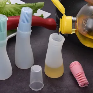 Bouteille de pinceau à huile en silicone résistant à la chaleur avec couvercle protecteur.
