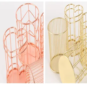 Detailansicht der glänzenden, herzförmigen Stifthalter in Gold und Roségold-Beschichtung